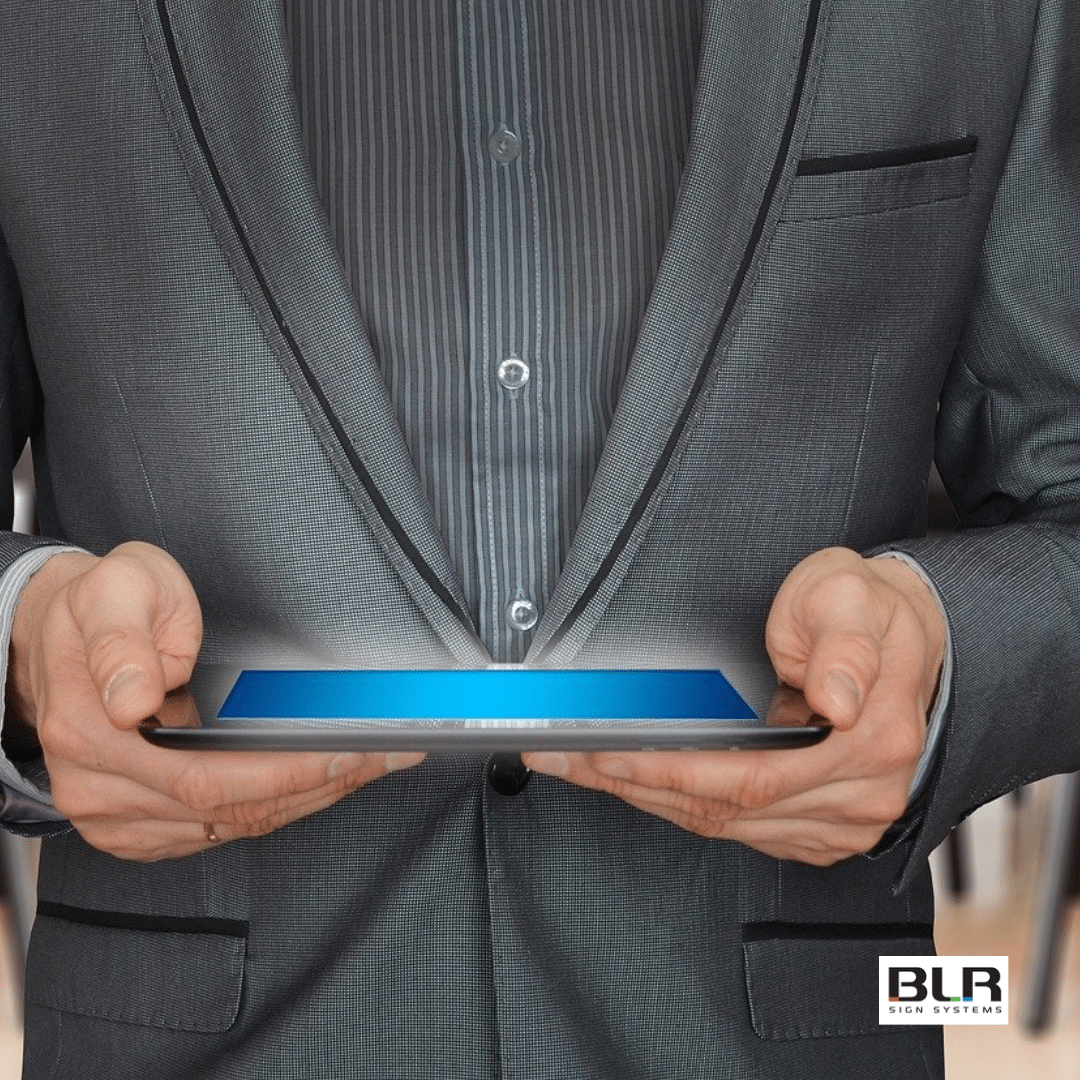 man holding ipad