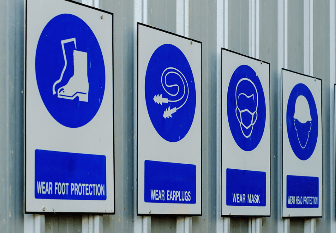 Construction Safety Week: protection signs on building