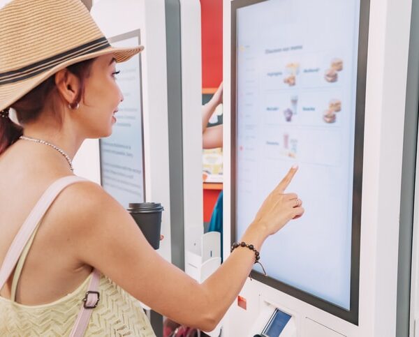 Retail shoppers engaging with digital signage tailored to their audience needs